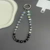 Nuevo cordón para teléfono móvil con cuentas de azúcar de cristal negro de alto valor, llavero para bolso estilo ins, cadena para teléfono móvil