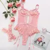 Nueva lencería sexy estilo europeo y americano para comercio transfronterizo, body sexy de malla de encaje con anillos en las piernas