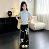 Conjunto Elegante de Dos Piezas para Niñas: Polo Casual de Manga Corta de Moda y Pantalones Anchos con Volantes Lindos, Estilo Coreano