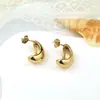 Brincos ovais ocos de aço titânio de mineração a quente transfronteiriços brincos ocos lisos semicirculares em forma de C de aço inoxidável dourado atacado feminino