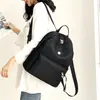 Mochila escolar de grande capacidade comércio exterior preferencial mochila casual feminina leve cor sólida tecido Oxford bolsa de viagem para mulheres