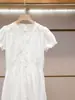 Vestido de Verano Nuevo de Alta Gama para Mujer de Shenzhen Estilo Casual Elegante Francés Bordado Hueco Blanco Manga Corta