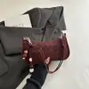 En stock elegante comercio exterior transfronterizo estampado de leopardo bolso de axila 2026 PU casual para commuting color sólido bolso de mano de lujo ligero