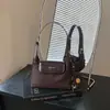Bolso de viajero transfronterizo moderno y elegante para el otoño de 2026: Estilo coreano, diseño de nicho, retro y único, adecuado para uso casual y como bolso de hombro o cruzado