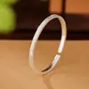 Pulsera Brillante Ovalada con Apertura de Flor Xiangyun de Plata 9999 Moda Simple Estilo Chino Pulsera Ajustable