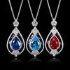 Otoño e invierno nuevo Zhuang Shengsheng joyería cobre chapado en oro simulación corindón rojo retro gota de agua personalidad colgante femenino 13*18