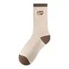 Calcetines Zhuji para mujer de otoño e invierno, longitud hasta la mitad de la pantorrilla, serie color marrón puro, medias de invierno sin costuras, calcetines de canalé a rayas Maillard