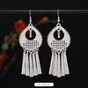 Brincos de borla de prata Miao artesanais estilo étnico vintage temperamento feminino Yunnan Miao personalidade estágio brincos longos versáteis