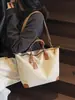 Bolsa de Lona Super Popular Transfronteiriça com Cores Contrastantes para Mulheres 2025 Nova Obra Commuter Portátil Bolsa Tote Retrô Versátil Bolsa Feminina