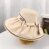 Chapéu feminino de borracha preto novo para primavera e verão chapéu de sol para viagem chapéu de sol para lazer ao ar livre chapéu de sol com laço