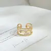 Anillo abierto personalizado bañado en oro real con incrustaciones de circonita para mujer, anillo geométrico de diseño nicho, exquisito anillo para el dedo índice al por mayor