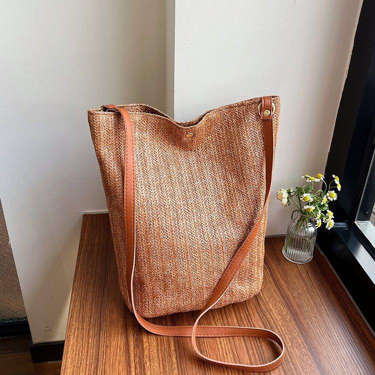 编织包女包新款潮2024夏草编简约百搭小清新水桶包个性单肩斜