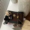 Bolsa transversal feminina para ir ao trabalho, novo modelo de verão da moda 2026, bolsa de ombro de nicho de alta qualidade, bolsa tipo saco super popular