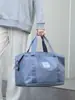 Bolsa deportiva portátil de gran capacidad transfronteriza para fitness, bolsa de viaje diagonal de corta distancia para mujer, bolsa de hombro repelente al agua para yoga, venta al por mayor