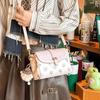 Bolsas Transfronterizas 2025 Nueva Bolso Cruzado para Mujer Bolso Pequeño Otoño e Invierno Regalo de Alta Gama Bolso de Hombro de Lona para Mujer