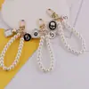 Estilo Nuevo de Primavera Chanel Perla Cadena de Mano DIY Hecho a Mano Bolso Casero Funda para Teléfono Móvil Llavero Accesorios