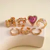 Juego de ocho piezas de anillos abiertos plisados de corazón y flor de resina y metal europeos y americanos, anillos personalizados de nicho vintage transfronterizos para el dedo índice