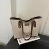 Bolsa tote de moda transfronteiriça, novo design retrô e minimalista, adequada para o trabalho, bolsa de ombro casual, bolsa de lona estilosa para mulheres