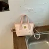 Bolsa de mão da moda e super popular para comércio exterior, nova bolsa versátil feminina para o verão de 2026, bolsa transversal com toque de luxo, bolsa tote pequena