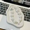 Cadena para teléfono de bola de felpa con perlas y cuentas para otoño e invierno, colgante de bolsa de bola de felpa lindo, llavero para teléfono de niña