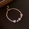 Pulsera de hebilla de herradura retorcida de circonita para mujer, lujo ligero, sensación de alta gama, diseño de pulsera Joker, joyería de nicho con temperamento, venta al por mayor