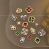 Explosiones de red de celebridades Buchelati arte de uñas joyería de circón estrellas aleación de cuatro hojas hueco diamante accesorios para uñas al por mayor