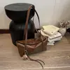 Nova bolsa retrô 2026 para trabalho e deslocamento para mulheres, outono e inverno, bolsa de ombro fofa e moderna, bolsa de axila e bolsa de mão