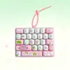 Teclado de dibujos animados lindo de 26 teclas, juguete para aliviar el estrés, colgante de llavero decorativo, venta al por mayor
