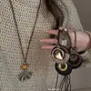 Otoño/Invierno 2026 Nuevo Estilo Étnico Retro Conjunto de Cuatro Collares Nudo de Lazo Cadena Larga de Lujo Ligero con Cadena para Suéter