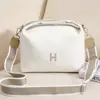 Bolso nuevo para mujer 2024 estilo ins, bolso de lona de color liso, gran capacidad, neceser simple, bolso cruzado artístico de un solo hombro estilo coreano