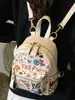 Mochila Pequena Graffiti de Nicho para Mulheres 2025 Nova Moda Verão Fofa Grande Capacidade Estilo Coreano Mochila de Viagem