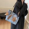 Bolso de mano informal de moda para mujer, estilo coreano, bolso de hombro de gran capacidad, mochila de nicho para invierno 2025, fácil de combinar.