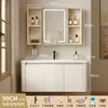 Tocador de baño engrosado y ahorrador de espacio con diseño en color crema, que cuenta con un lavabo redondeado, lavabo cerámico integrado y un lavabo de una sola pieza.
