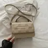 Bolsa de ombro xadrez de alta qualidade e design exclusivo para mulheres, nova bolsa de ombro versátil estilo coreano da moda 2026