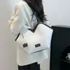 Bolsa Tote Retrô de Grande Capacidade Clássica Nova Verão 2025 Bolsa de Ombro com Textura de Alta Qualidade Versátil para o Dia a Dia Bolsa de Braço