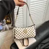 Bolsa de bolinhas feminina 2026 nova chegada design de nicho bolsa de ombro único moda popular para o dia a dia bolsa de axila bolsa feminina com corrente