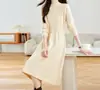 Vestido de punto largo elegante de alta gama para mujer, otoño e invierno, cuello semialto, longitud media, corte holgado, adelgazante, base de color liso