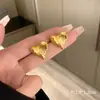 Pendientes de estilo antiguo europeo y americano Pendientes de estilo francés de lujo ligero de alta gama únicos Pendientes de diseño de nicho nuevo Pendientes retro para mujer