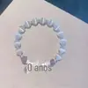 Pulseira de Vidro com Fragmentos de Jade Borboleta Estilo Novo para Mulheres, Pulseira de Girassol de Cristal Colorido Explosivo de Nicho, Em Estoque para Venda no Atacado para Barracas de Mercado
