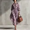 Coleção outono 2026 europeia e americana transfronteiriça: vestido maxi estampado em sarja, com mangas bufantes e saia ampla, cintura marcada, perfeito para férias em um resort