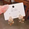 2025 Nuevos Pendientes Exquisitos de Flor con Lazo y Circonita Estilo Coreano Elegantes Versátiles de Moda Pendientes con Estilo
