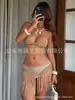Conjunto de biquíni de crochê feito à mão estilo europeu e americano com top halter, saia de rede com franjas, maiô de duas peças para férias na praia