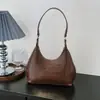 Bolso Cruzado de Hombro Único con Colgante Texturizado Color Sólido Casual Estilo Coreano Verano 2026 Nuevo Elegante Bolso Dumpling para Mujer