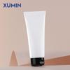 Material de embalaje Xumin 100MLPE botella tubo esmerilada botella limpiadora facial tubo cosmético negro tapa abatible botella mascarilla limpiadora