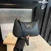 Bolsa de Ombro/Mão Elegante Única de Alta Qualidade Versátil com Padrão Lichia Laço Nova Moda Primavera 2026