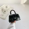 Mini bolso de diseño de nicho para lápiz labial para mujer 2023 primavera y verano nuevo bolso de mensajero portátil bolsa cuadrada pequeña con espejo de alta calidad