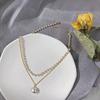 Collar de perlas apiladas de doble capa europeo y americano para mujer ins Estilo súper hada frío elegante cadena para clavícula accesorios de alta gama de lujo ligero