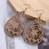 Aretes de madera más vendidos de comercio electrónico transfronterizo, moda europea y americana, aretes de madera geométricos huecos exagerados hechos a mano