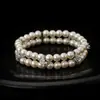 Pulsera de Doble Capa con Perlas y Zirconias Europeas y Americanas Transfronterizas con un Diseño Único, Joyería de Mano Exquisita y Versátil para Mujeres
