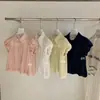 Wgwe9133 Guangzhou Shisanxing Moda Feminina Verão 2026 Novo Top Camisa Gola Polo Estilo Francês Manga Curta Solta